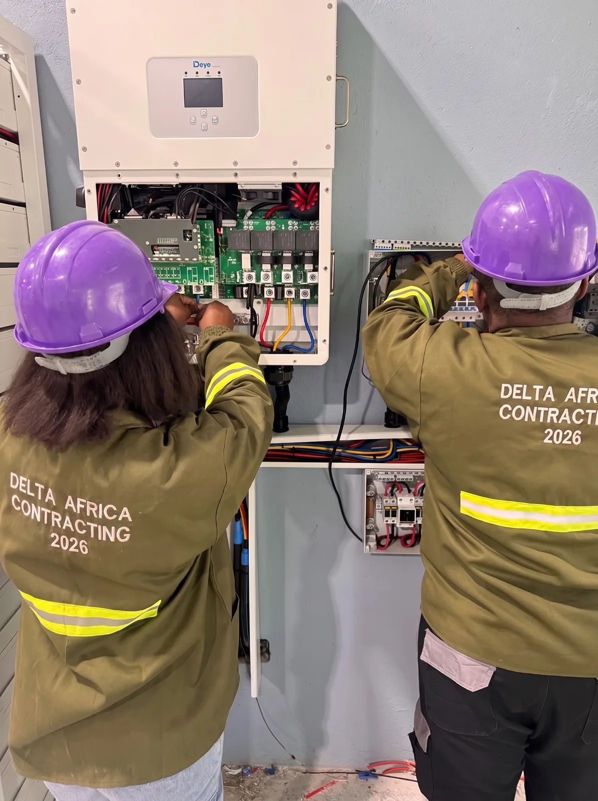 Delta Africa Contracting engineers installing a solar inverter system